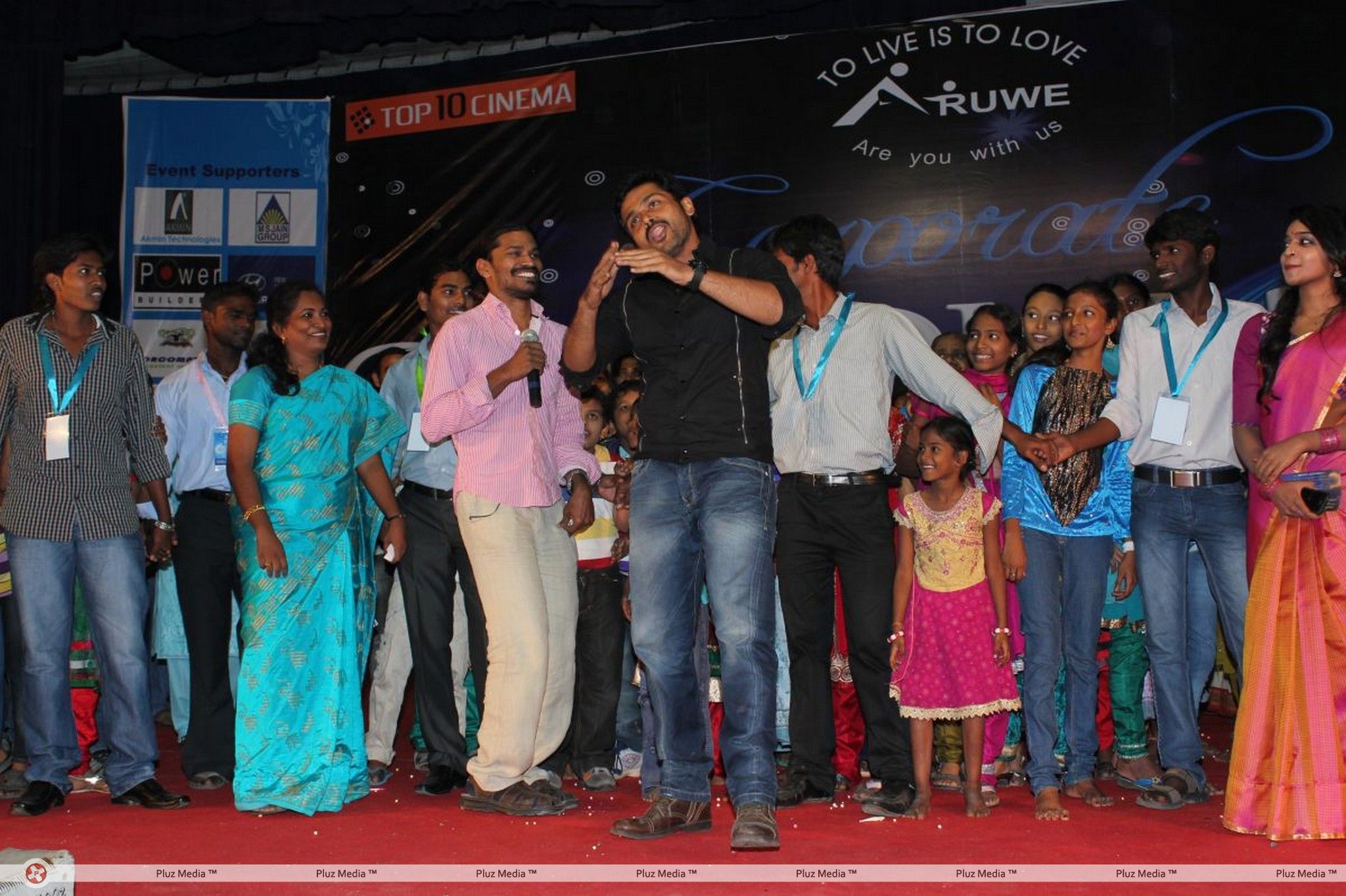 Karthi Dancing with Aruwe Homeless Children Stills | Picture 381590