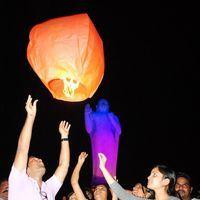 Flying Sky Lanterns at Buddha Statue